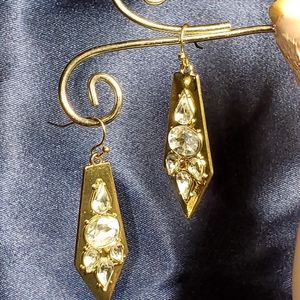 Gold tone w/ clear stones.